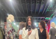 NKPR’s IT HOUSE Gifting Lounge for TIFF 2026 Trying on a satin skirt and blouse from Melanie Lyne's fall 2026 collection at NKPR's IT HOUSE TIFF gifting lounge.